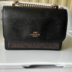 Coach crossbody bag with leather/ chain strap.